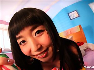 japanese star Marica Hase plays with candy stiffy