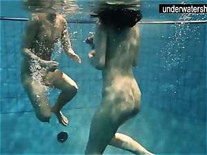 two sexy amateurs showcasing their bods off under water